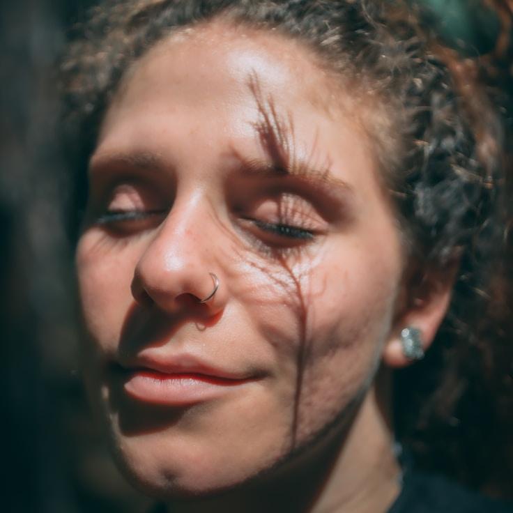 Nia Kapoor, Lead Design Curator at Nook Ridge Quartz, reviewing corporate floral arrangements